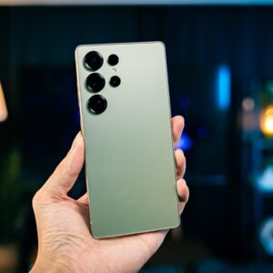 A person holding a cell phone in their hand